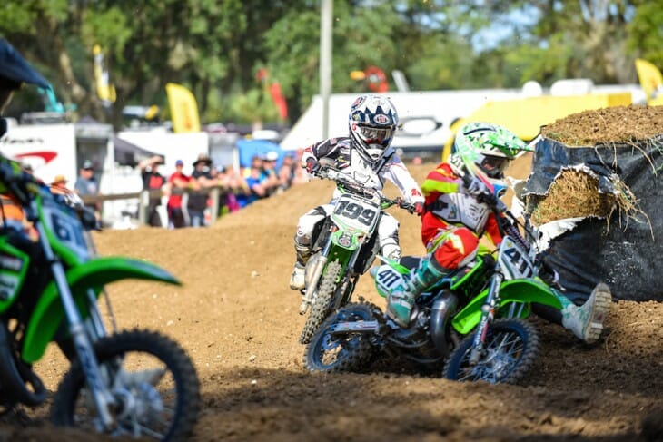 Ryder Difrancesco (199) and Nicholas Romano battle in the 65cc class.