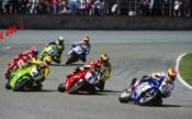 Colin Edwards leads early in the 1995 Daytona 200 ahead of Troy Corser (1), Scott Russell (4), Miguel Duhamel (behind Corser), Carl Fogarty (behind Russell), Anthony Gobert (96) and Jamie James (2). (Henny Ray Abrams photo)