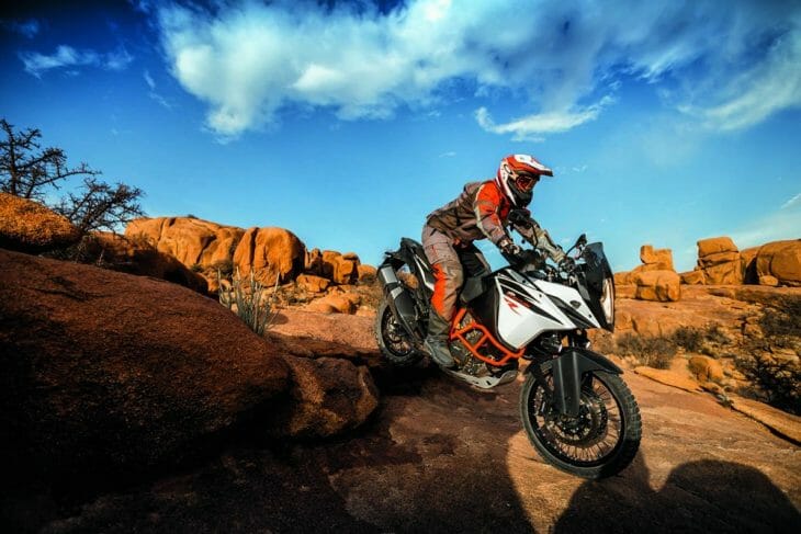 Adventure R rider dropping down rocks Adventure R rider dropping down rocks