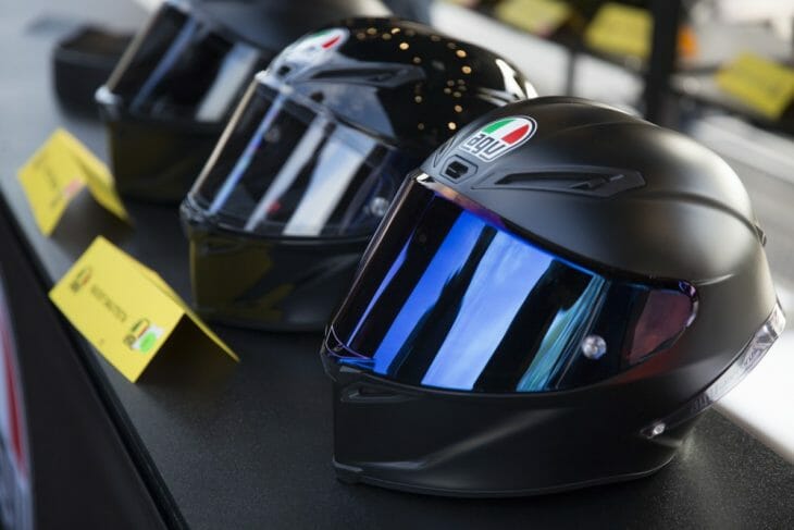 AGV helmets sitting on the bench.
