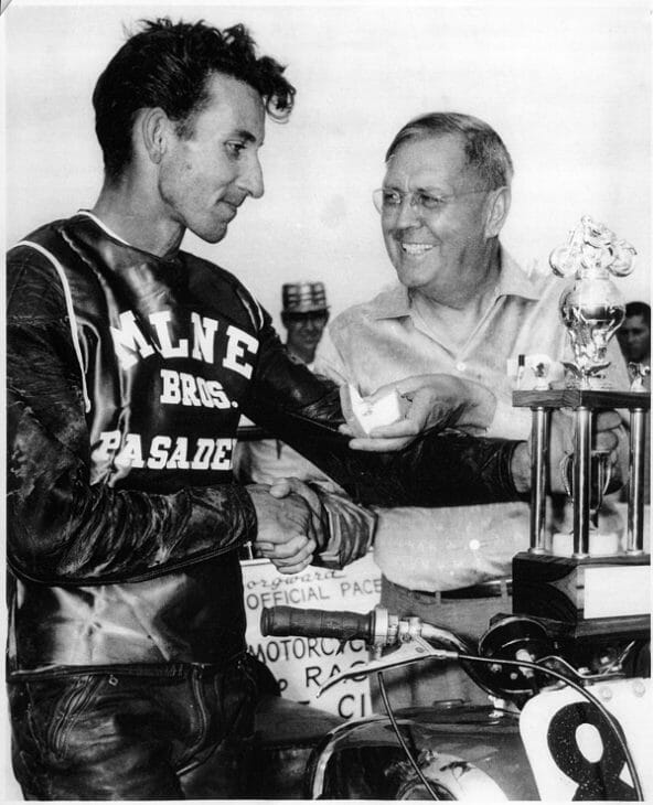 George Everett receives a trophy from Floyd Emde.