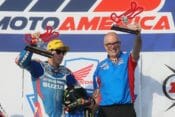 Yoshimura Suzuki's Roger Hayden led every lap of Saturday's Race 1 en route to his third MotoAmerica Superbike victory of the season. Here he celebrates on the podium with team technician Darin Marshall. (Photo by Brian J. Nelson)