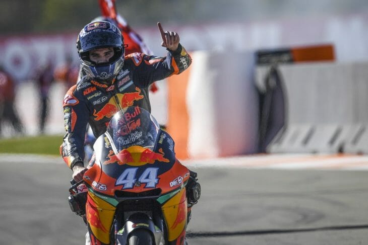 Miguel Oliveira (Red Bull KTM Ajo) made it a stunning third time in a row for KTM to cheer him over the line in the lead at Valencia