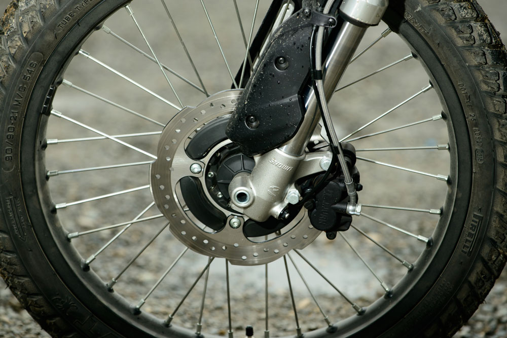 The FX’s front brake disc is the same size as the rear with one more piston. Say what?