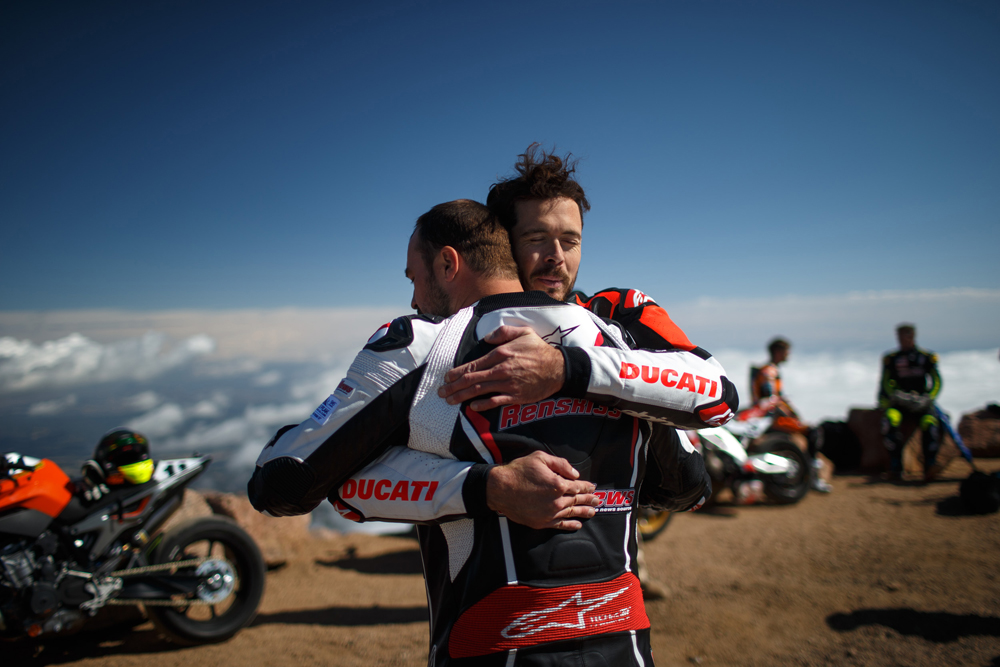 The two fastest men up Pikes Peak give each other a congratulatory hug. There was no denying Carlin earned it.