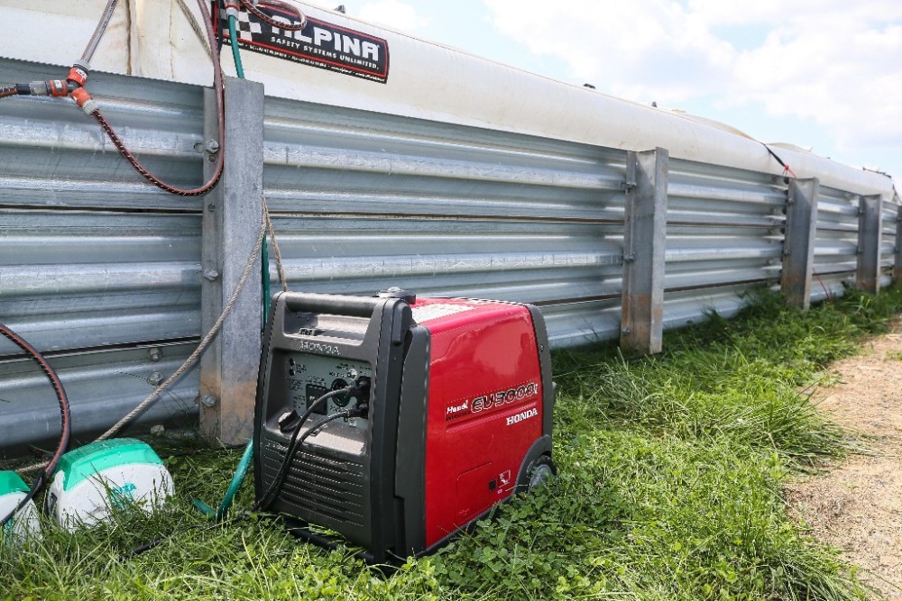 Among the many uses for the Honda generators is to keep the Alpina inflatable safety barriers inflated during a race weekend.| Photo By Brian J. Nelson