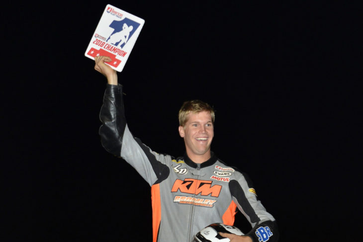 Dan Bromely celebrates winning the number-one plate in Singles.