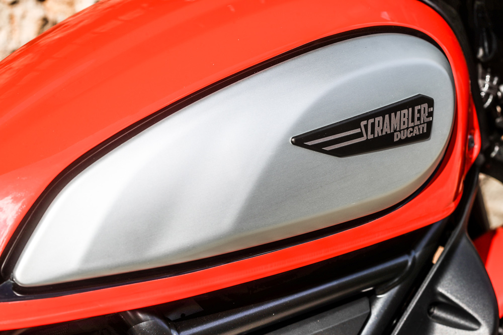 New side tank panels are larger and now sport that black outline pin striping.