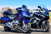 Picture a clear desert road, your perfect partner on the back and either of these two motorcycles beneath you. Sounds good, right? But which one is better if you want to mash those miles? We did the dirty work for you to find out