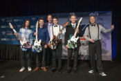 We are the champions: (From left to right) JD Beach, Cameron Beaubier, Dunlop's Mike Buckley, Alex Dumas, Andrew Lee and Chris Parrish (sans his guitar that got delayed in shipping) celebrate with their custom Dunlop guitars. Photo by Brian J. Nelson.