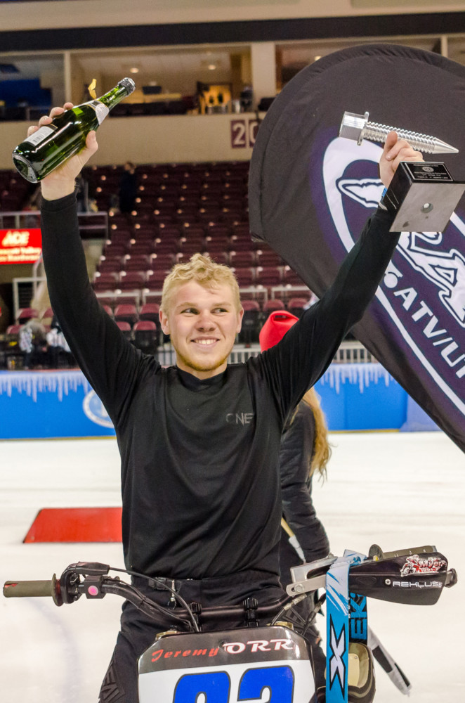 Jeremy Orr takes his first-place trophy with a smile.