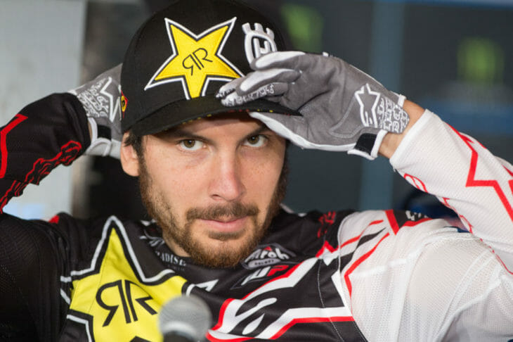 Jason Anderson putting his hat on during the 2019 Anaheim Supercross. 