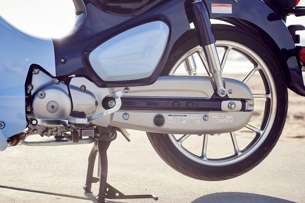 The chain on the 2019 Honda C125 Super Cub is fully enclosed.