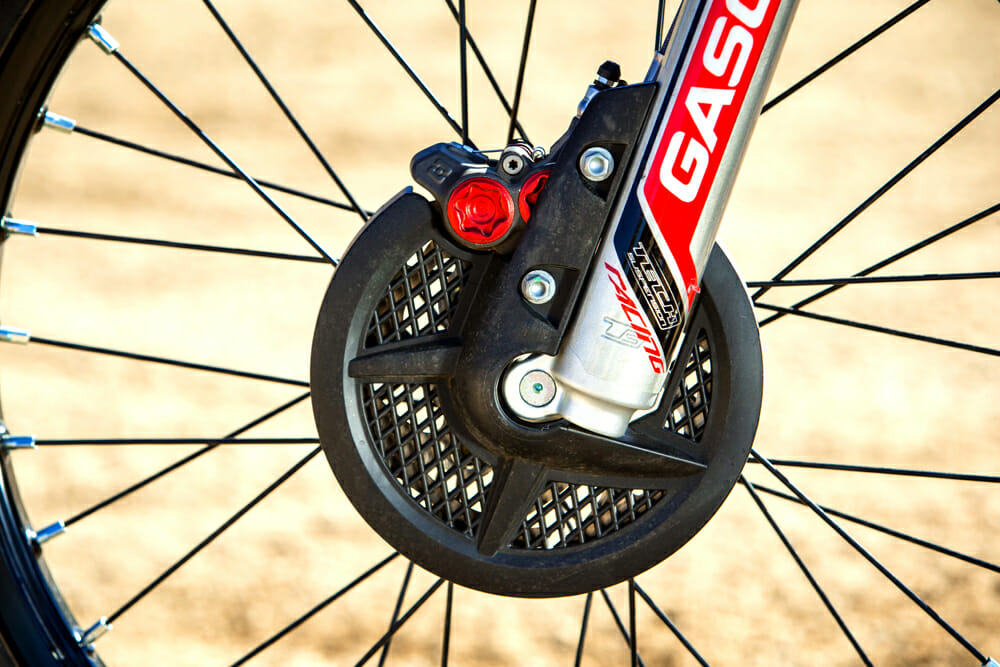 The front brake on the 2019 GasGas TXT Racing 300 is well protected.