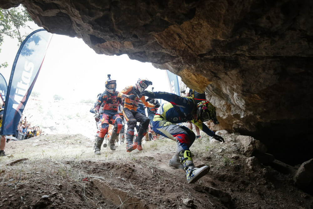 Riders race on foot to their bikes located in a cave - © Future7Media