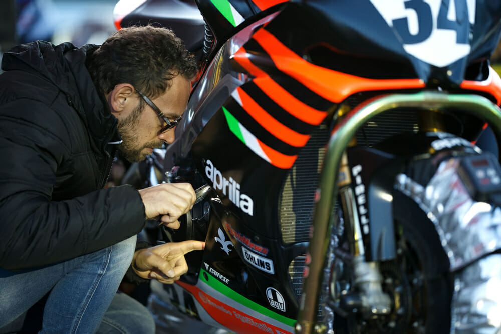 Nicola Marcato inspects the Aprilia during Day Three of practice. His expertise in mapping the Aprilia made all the difference in overall performance.