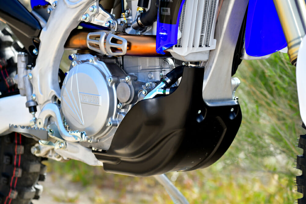 The new WR shares many of the same off-road ingredients that set it and the 2019 YZ450FX apart from the YZ450F, like having an 18-inch rear wheel, wider gear ratios, larger fuel tank, tamer engine mapping, softer suspension, O-ring chain, skid plate, and a kickstand.