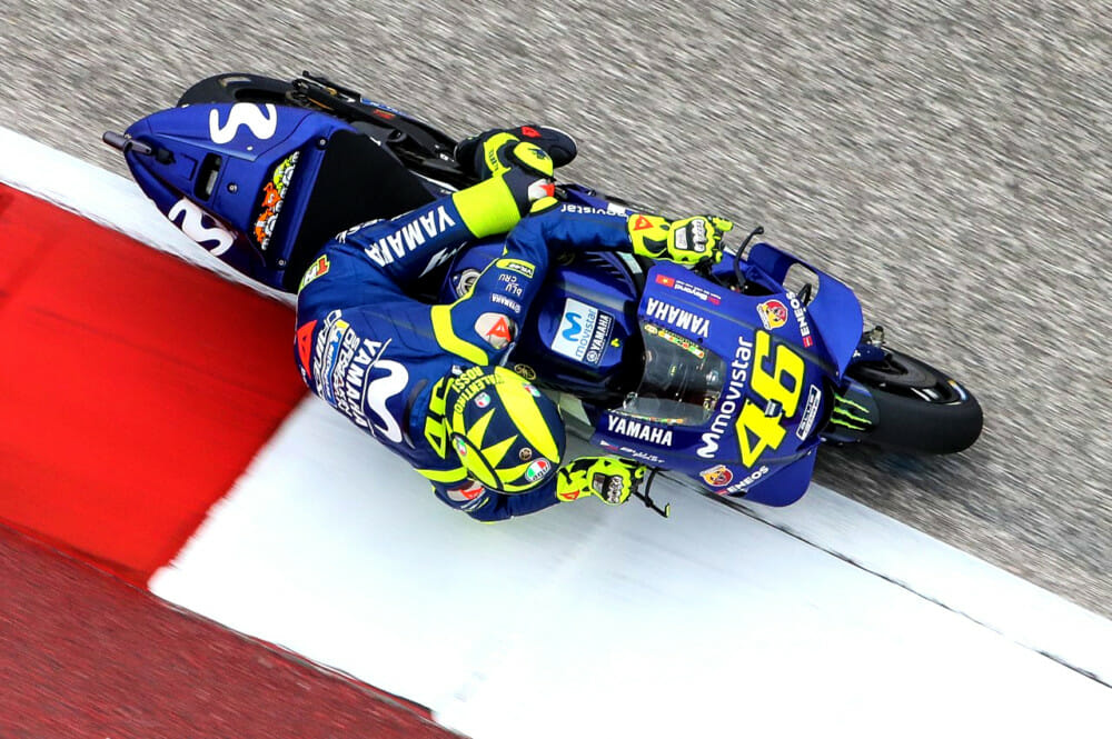 Valentino in action. Check out his arms—they look so relaxed he could take them off the handlebar and wave to the crowd, which he often does.