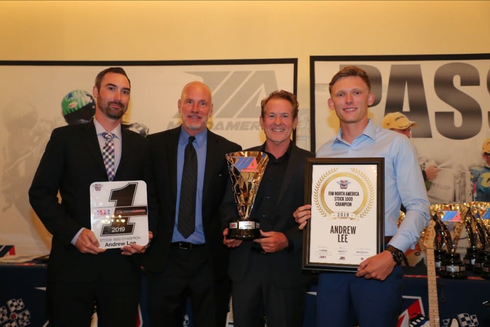 (From left to right) Crew chief Derek Keyes, Massey, MotoAmerica Communications Manager Paul Carruthers and Andrew Lee hold Lee's MotoAmerica Stock 1000 Championship awards.|Photo by Brian J. Nelson