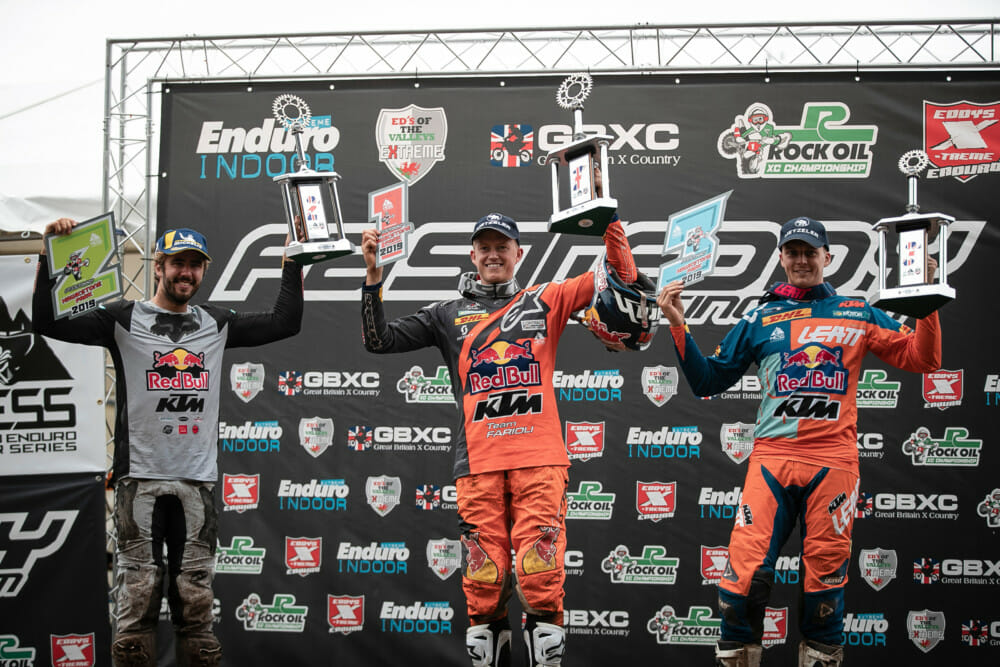 Winners Nathan Watson, Manuel Lettenbichler and Jonny Walker celebrate on the podium at the sixth stop of the World Enduro Super Series at Hawkstone Park, England on September 22, 2019.