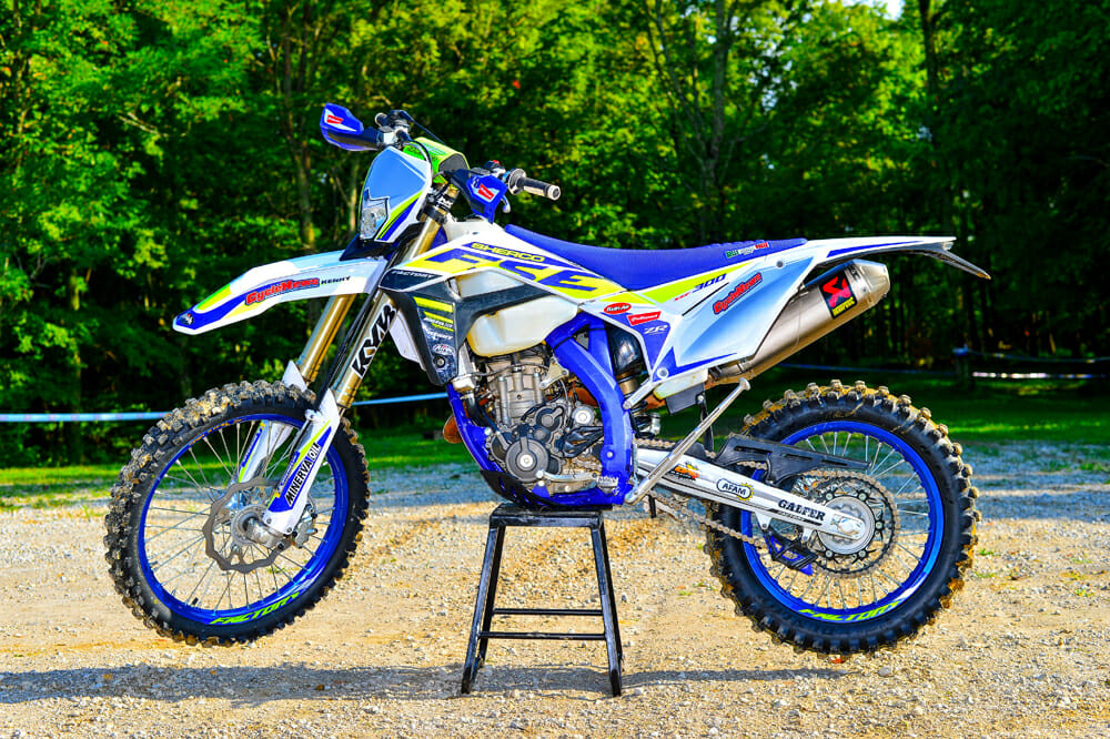 The 2020 Sherco 300 SEF is nicely trimmed with a Selle Dalla Valle gripper seat cover, blue Excel rims, steel rear sprocket, dual compound grips, and a Neken bar pad.