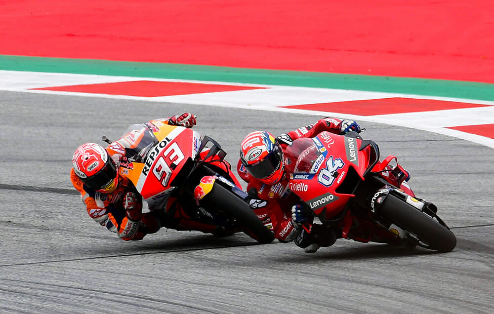 Occasionally Marc Marquez had to settle for second, as he did here by losing a final corner battle with Andrea Dovizioso in Austria.