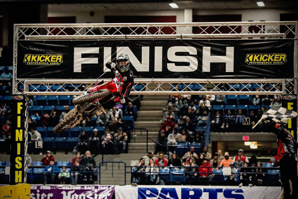 Kyle Peters taking the checkered flag and the win in the Arenacross 450 Pro Sport Main Event.