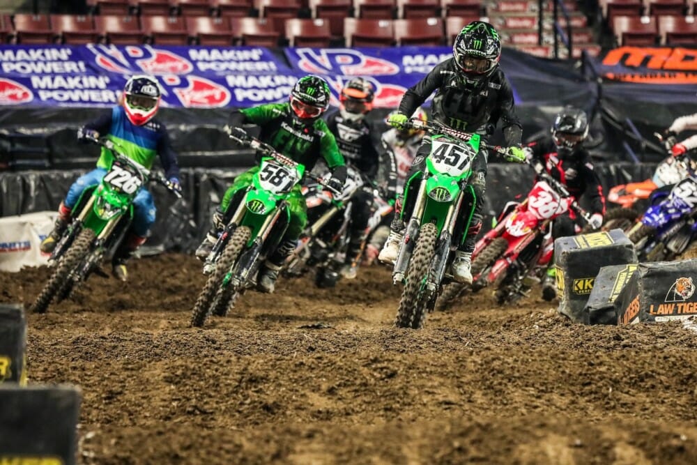 Team Babbitt's riders Darian Sanayei (457) and Kyle Bitterman (581) battling it out at Salt Lake City Arenacross.