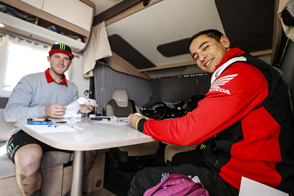 Ricky Brabec reviews the Dakar Rally roll chart with his Monster Energy Honda teammate Nacho Cornejo. 