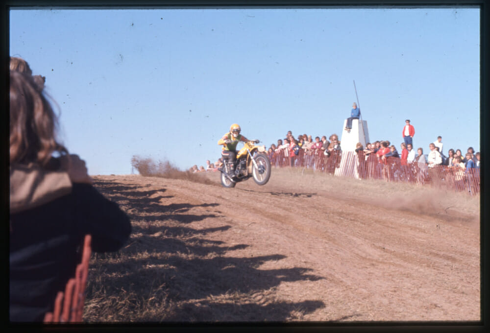 Roger DeCoster roosts the factory Suzuki Canada. 