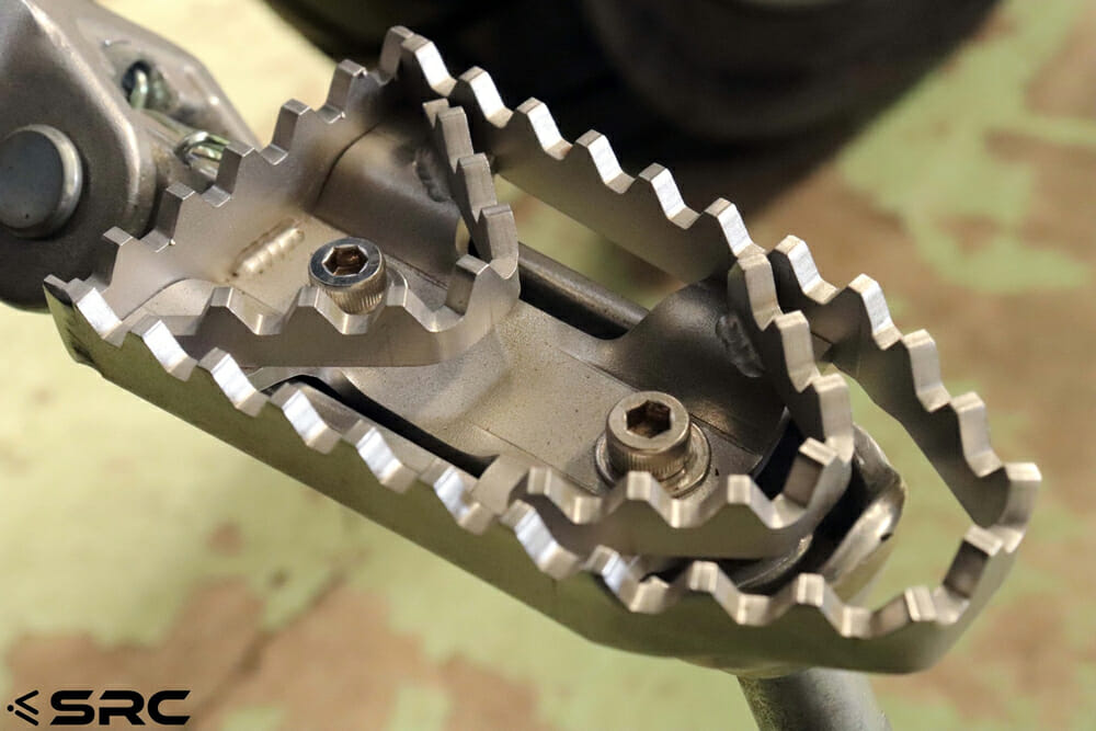 The SRC Moto wide footpeg adaptors for ADV bikes have a have an aggressive tooth profile.