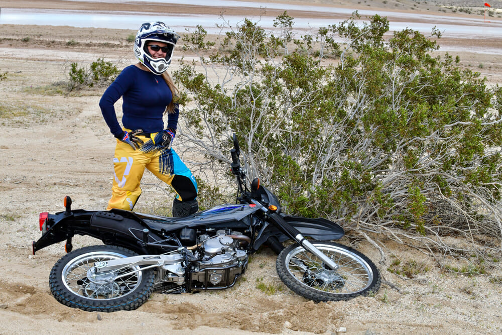 woman learning to ride a motorcycle