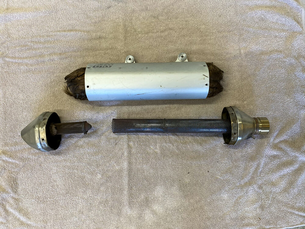 KTM Muffler Repacking Example: While most mufflers will come apart on one end, the KTM EXC mufflers come apart on both ends.