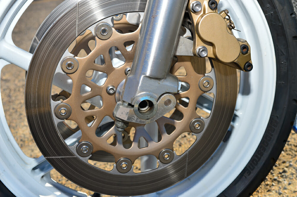 Quick-release axles on the 1990 Honda RC30's front wheel.