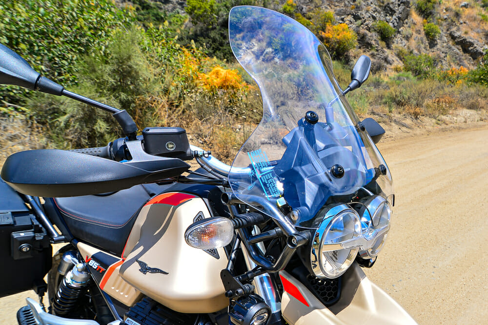 Larger screen, heated grips and fog lights are part of the touring package for the 2020 Moto Guzzi V85 TT Travel touring bike.