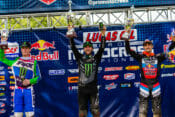 It was a good day for defending 450MX Champion Eli Tomac at the Ironman National Motocross in Crawfordsville, Indiana, August 29. The Monster Energy Kawasaki rider managed to take a big chunk out of Zach Osborne’s lead in the championship after going 2-1 on the day for the overall win, which he had to fight for. The first moto, however, was all Marvin Musquin’s on the Red Bull KTM. It was a year ago to almost the day that Musquin injured his knee at this very track that resulted in him sitting out the entire 2020 Supercross season. He put that disaster out of his head in a big way and dominated the first moto with a wire-to-wire win, but there was still plenty of action to watch behind him. Tomac, who wanted to finish ahead of Osborne at all cost, got away in second but had Osborne right behind him and was threatening the Kawasaki rider for the position—and did so for a long time. But a run-in with a lapper and a bout with arm-pump eventually got the best of Osborne who slipped back to sixth by moto’s end. Tomac finished a distant second to Musquin, followed by Adam Cianciarulo (Monster Energy Kawasaki) and a hard-charging Chase Sexton (Honda HRC). Osborne wanted to get some of those points back in the second moto and darted into the lead to start the second moto ahead of Cianciarulo and Tomac. Cianciarulo, who could taste his first 450MX-class win, got around Osborne on the third lap and tried sprinting away, but Osborne stayed with him for a while before changing his attention to Tomac, who was on the attack right behind him. Tomac eventually got around Osborne, and then his teammate, Cianciarulo, but wasn’t out of the woods just yet. Seemingly out of nowhere, Justin Barcia (Monster Energy Yamaha) made his way up through the pack and started challenging Tomac for the lead! Barcia chased Tomac for the last four laps but couldn’t find an opening he needed to make the pass. Tomac took the moto win just 1.103 seconds ahead of Barcia and another 20 seconds ahead of third-place Osborne. Cianciarulo slipped back to fourth, followed by Sexton and first-moto winner Musquin, who got off to a bad start and later admitted that he just didn’t have the intensity that some of the riders ahead of him had in that moto. Musquin’s 1-6 still gave him second overall, with a 3-4 getting Cianciarulo on the podium for the second week in a row. Barcia, sixth in the first moto, ended up fourth overall, while a 6-2 got Osborne fifth. In the championship, Tomac pulled 13 points on Osborne, who is still on top of the leaderboard with 122 points. Musquin is second with 109, followed by Barcia with 96 and Tomac with 95. After pulling out of the first moto, Jason Anderson did not start the second, complaining of pain in his arm from an earlier injury. Max Anstie also retired early with an injury from a second-moto crash. In the 250MX class, it was another frustrating day for points leader Ferrandis who was clearly the fastest rider on the track but didn’t come away with the win, which instead went to his nearest rival in the championship Jeremy Martin. Ferrandis was in a class of his own in the first moto. He chose the far inside on the starting gate and made it work by grabbing the early lead and running off with the win. And no one was close. The Monster Energy/Star Racing Yamaha team rider eventually took the checkered flag 26 seconds ahead of Martin, who started right behind Ferrandis off the start but just couldn’t match Ferrandis’ speed. Brandon Hartranft (Troy Lee Designs/Red Bull KTM) was third, followed by Jett Lawrence (Geico Honda), and RJ Hampshire (Rockstar Energy Husqvarna), who were all fairly spread out as the top five crossed the finish line. Shan McElrath, however, was right behind Hampshire, who was just ahead of Alex Martin, Justin Cooper and Cameron McAdoo. Going into the second moto, Ferrandis looked to be in good shape to get the overall win based on his performance in the first moto, but a first-turn crash that involved his teammate McElrath, McAdoo and a couple of other riders, put Ferrandis to the back of the 40-rider field while Martin got away out in front, which was bad news for Ferrandis. Martin went on to win the moto, but all eyes were focused on Ferrandis, who had no shot at the overall victory but needed to minimize the damage as best he could. Ferrandis quicky worked his way up through the field, passing riders in bunches in the early half of the race. Late in the race, Ferrandis made a couple of big passes on Jett Lawrence and Brandon Hartranft to get third in the moto, finishing just 10 seconds behind winner Martin and five seconds behind runner-up Cooper. So, what could’ve been a disaster of a day for Ferrandis ended up not being so bad. He somehow managed to retain the red plate as the points leader. However, his lead did shrink a little bit, but it could’ve been much worse for the Frenchman. He now leads Martin by four points with three of nine rounds in the books. Alex Martin, sixth overall on the day, is 31 points in back of his younger brother in third. McElrath is another five points back in fourth. Hampshire (5-17), who was fast and aggressive all day but the victim of a second-moto crash, holds down fifth in the championship, five pints behind McElrath. CN