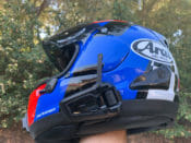 Cardo Packtalk Black helmet communication system installed on a helmet
