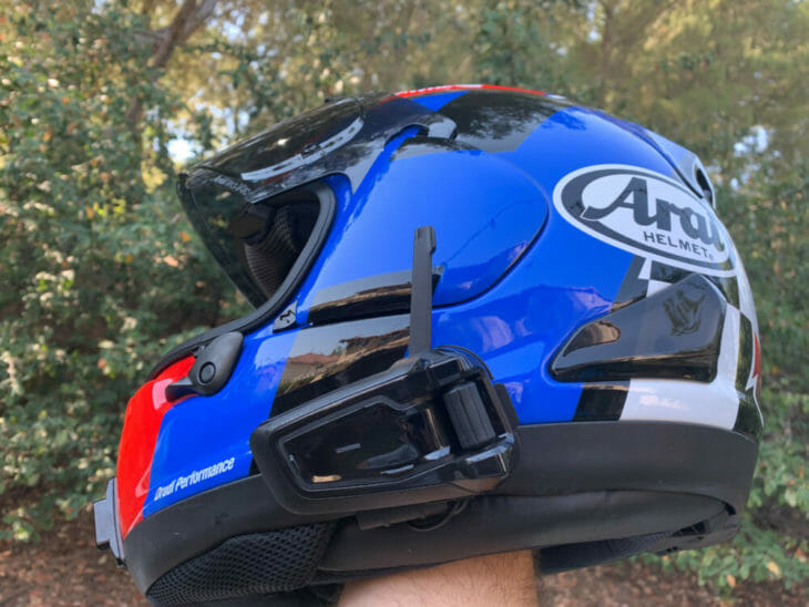 Cardo Packtalk Black helmet communication system installed on a helmet