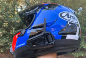 Cardo Packtalk Black on a blue Arai helmet