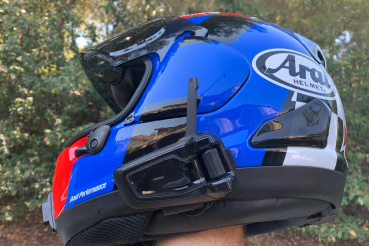 Cardo Packtalk Black on a blue Arai helmet