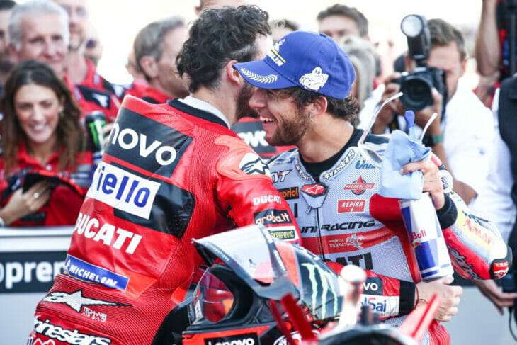 Pecco Bagnaia (left) hugs future teammate Enea Bastianini at Aragon.