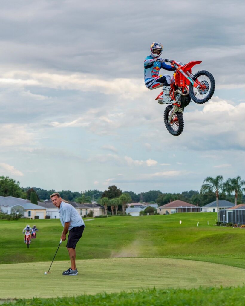motorcycle racer jumping at Golf course