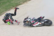 Motorcycle racer crashing