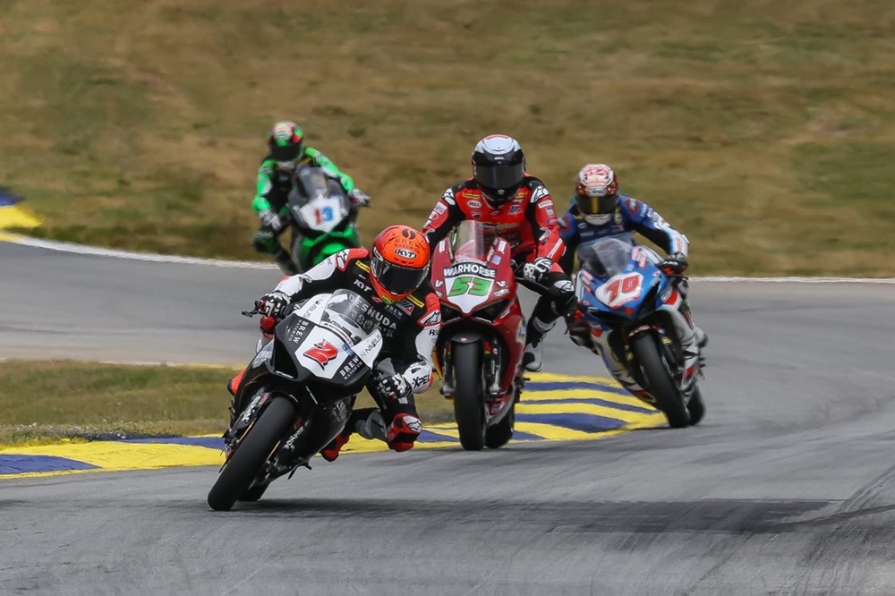 Josh Herrin (#2), Darryn Binder (#53), Tyler Scott (#70), and Kayla Yaakov (#19).
