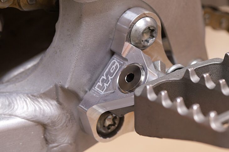 Works Connection YZ125 YZ250 Footpeg Mounts installed closeup