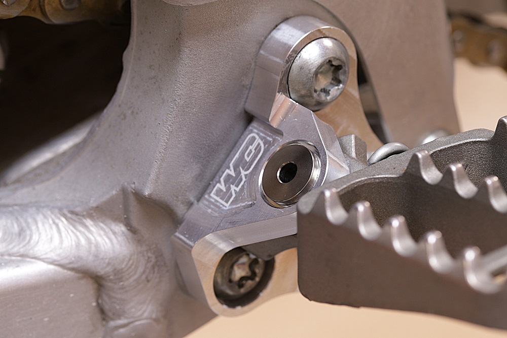 Works Connection YZ125 YZ250 Footpeg Mounts installed closeup